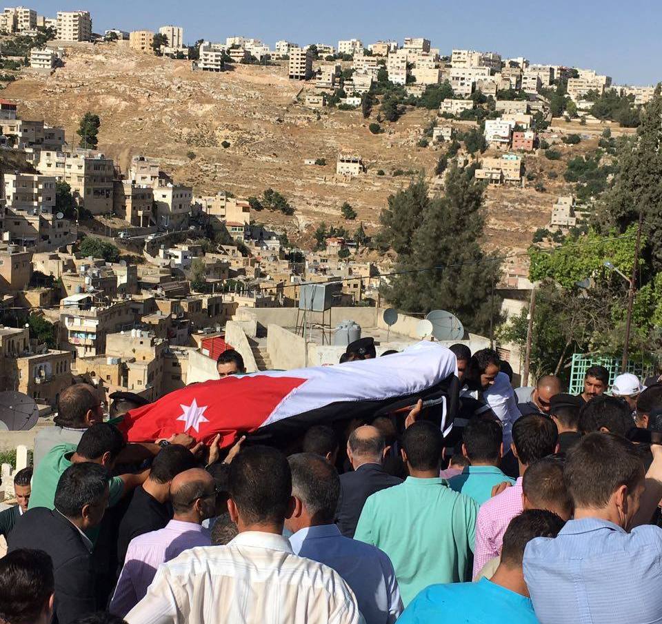 People attend the funeral of Corporal Omar Hiyari in the city of Salt on Monday. Hiyari was killed in a terror attack against the office of the general Intelligence Department in Baqaa refugee camp early Monday (Photo by Osama Aqarbeh) 